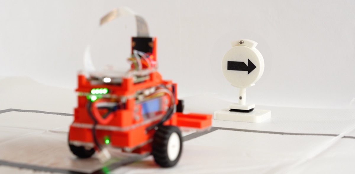 Smart car recognizing road signs and reacting on the smart game field.